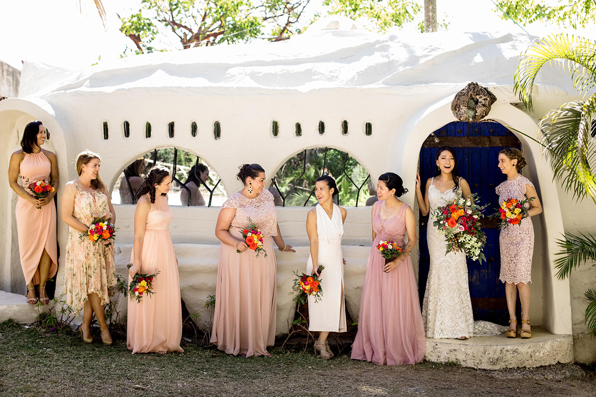 a bride and her bride's maid in a tropical wedding