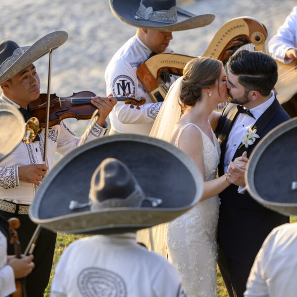 a couple surround of mariachi in puerto vallarta
