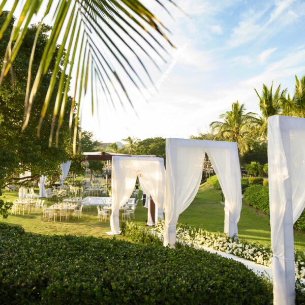 idyllic destination wedding with greenery and white arches in puerto vallarta