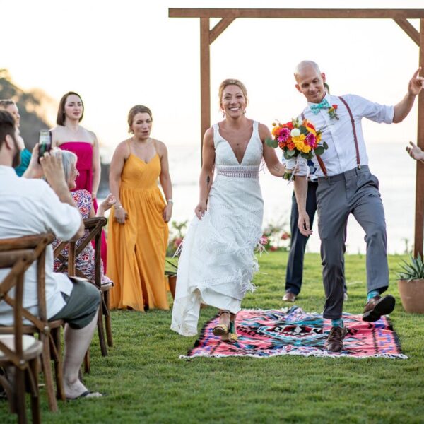 wedding in front the ocean with vibrant color in puerto vallarta