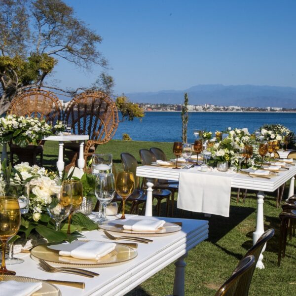 greenery wedding with white furniture in front the ocean